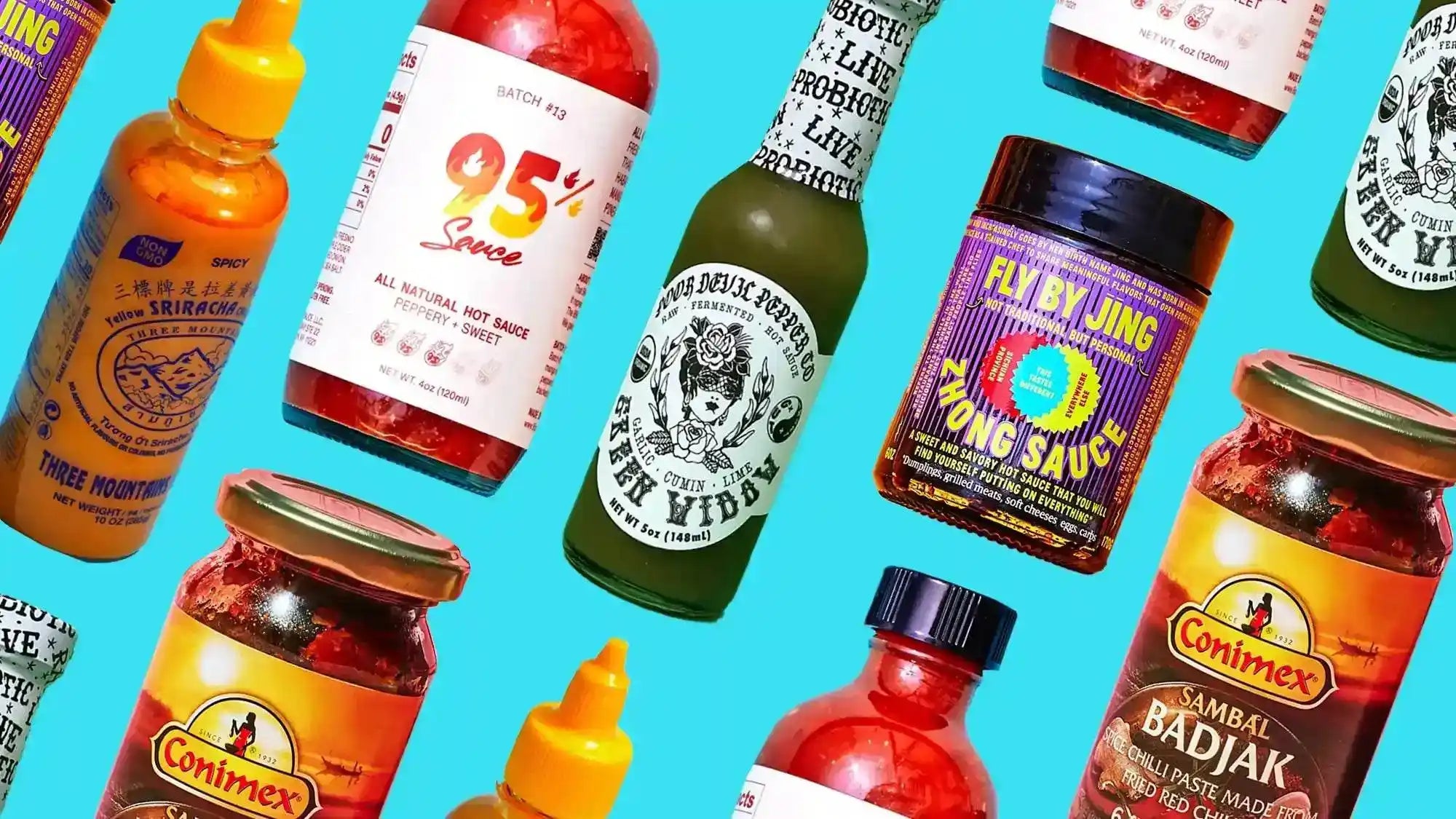 A collection of various hot sauces and chili pastes in bottles and jars.