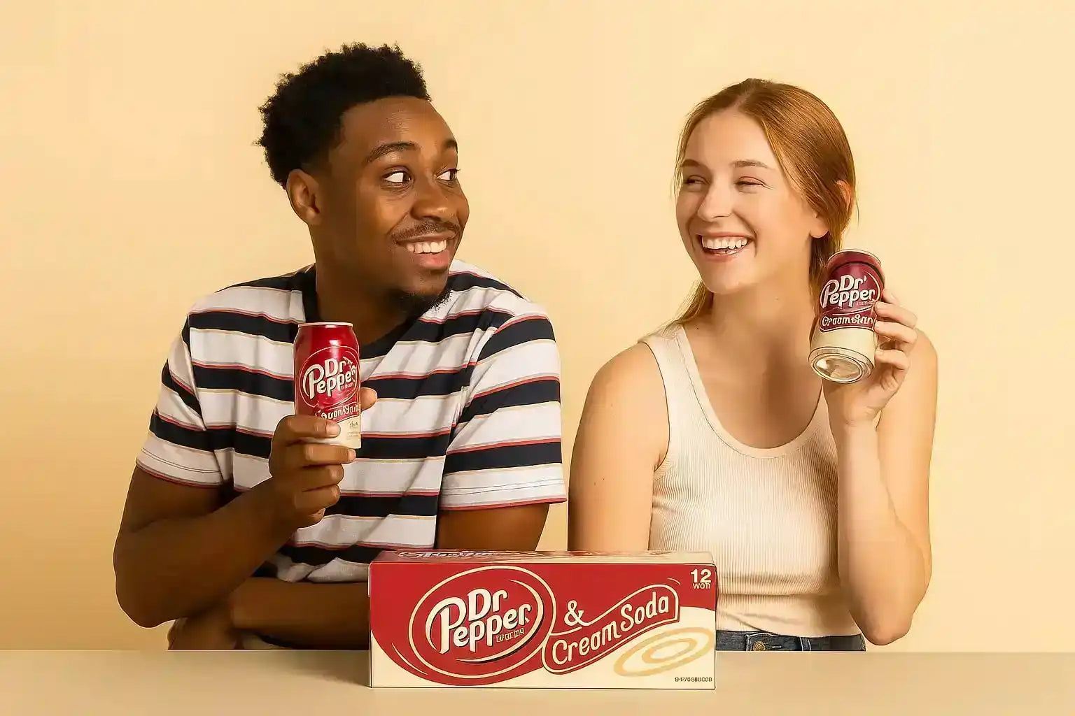 Two smiling people holding cans of Dr. Pepper & Cream Soda with a 12-pack case below.
